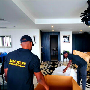 "Premier moving services in Ghana by AA+ Movers, showcasing workers unpacking items at Villaggio Vista, the tallest residential tower in Airport Residential Area, Accra."